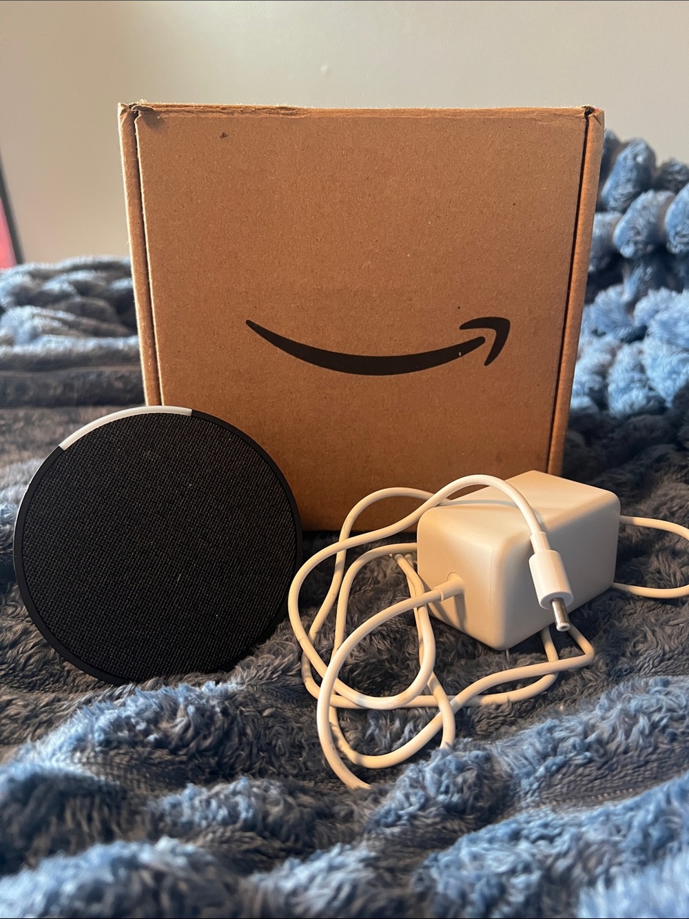 Amazon Alexa Black Bluetooth Speaker with White Charging Cable